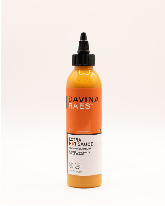 Bottle of Davina Raes Extra Hot Sauce on a white background